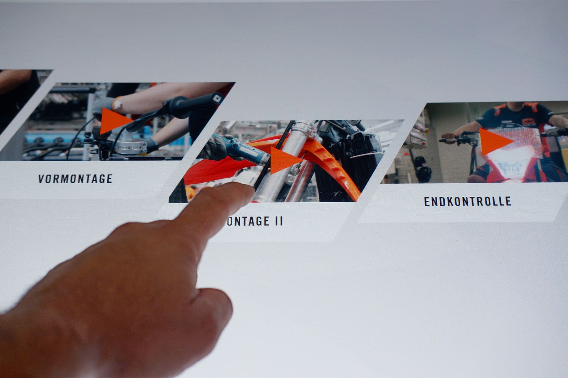 Close-up of the hand in interaction: touch gesture on one of the UI elements