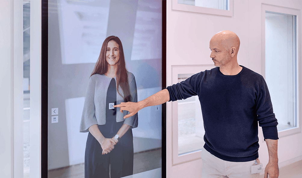 Almost life-size person on portrait-format screen